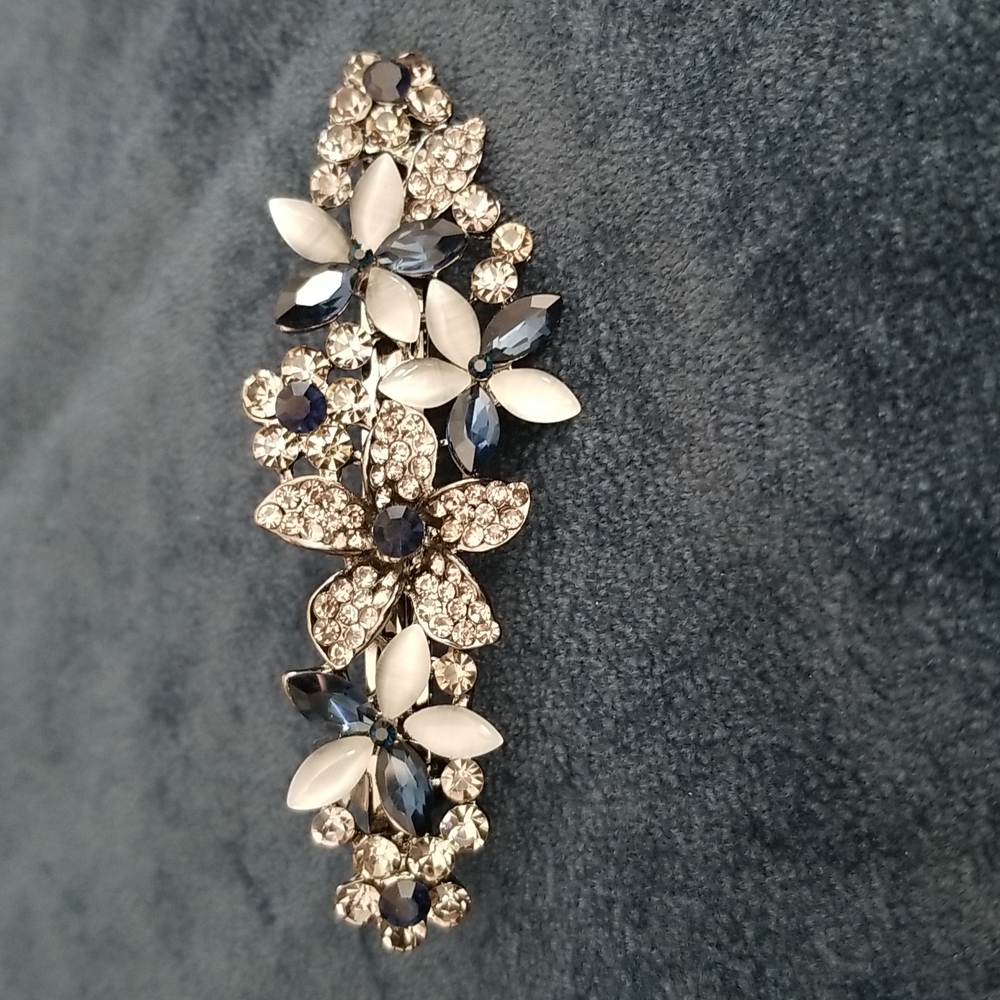 Hair accessory. Black metal with blue and gray crystals.
